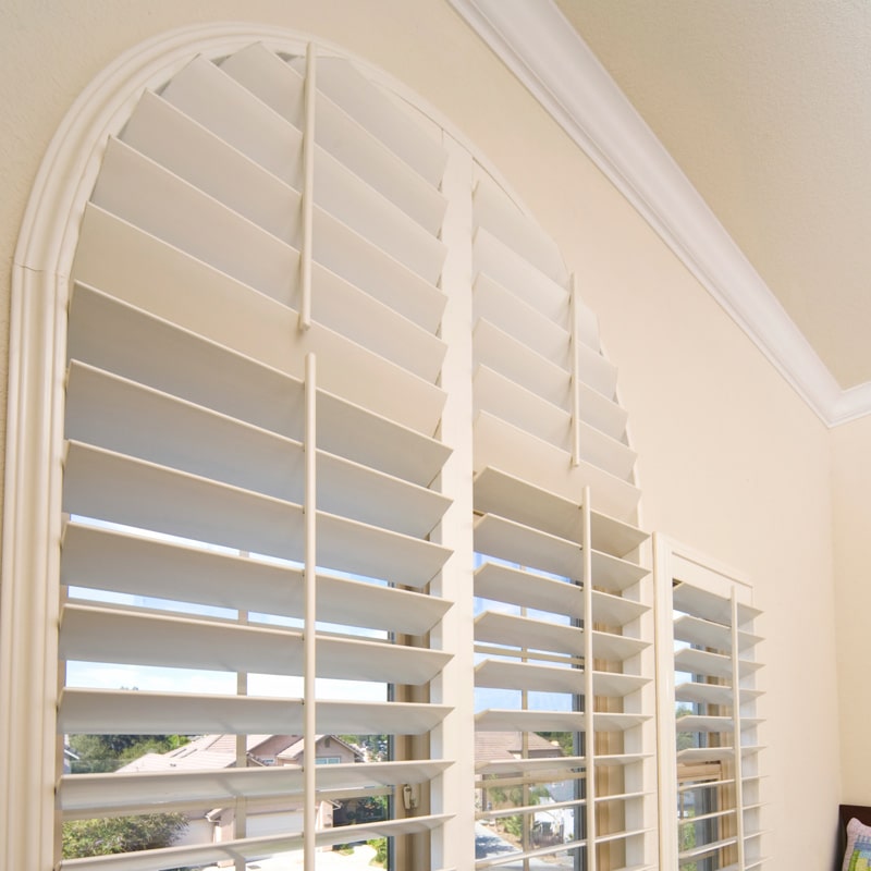 These custom half circle top shutters really compliment this decor. We build a custom frame around these shutter panels to give it that custom built in look. Shutters have been around for years and they are still a staple in most of our designs.