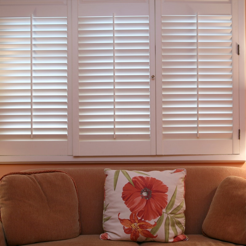 These classic white shutters finish this family room. Shutters are great for adjusting the light entering the room. We can do single panels or double hung. We can custom match the stain to your existing wood trim or an accent piece of furniture.