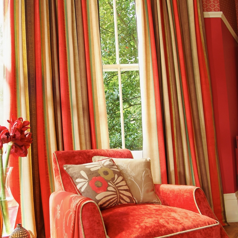 Alternating red, green and cream color stripes enhance this luxurious drapery treatment. We can top off this treatment with an upholstered cornice or box pleated valance. We can coordinate the colors in the room to best compliment each other.