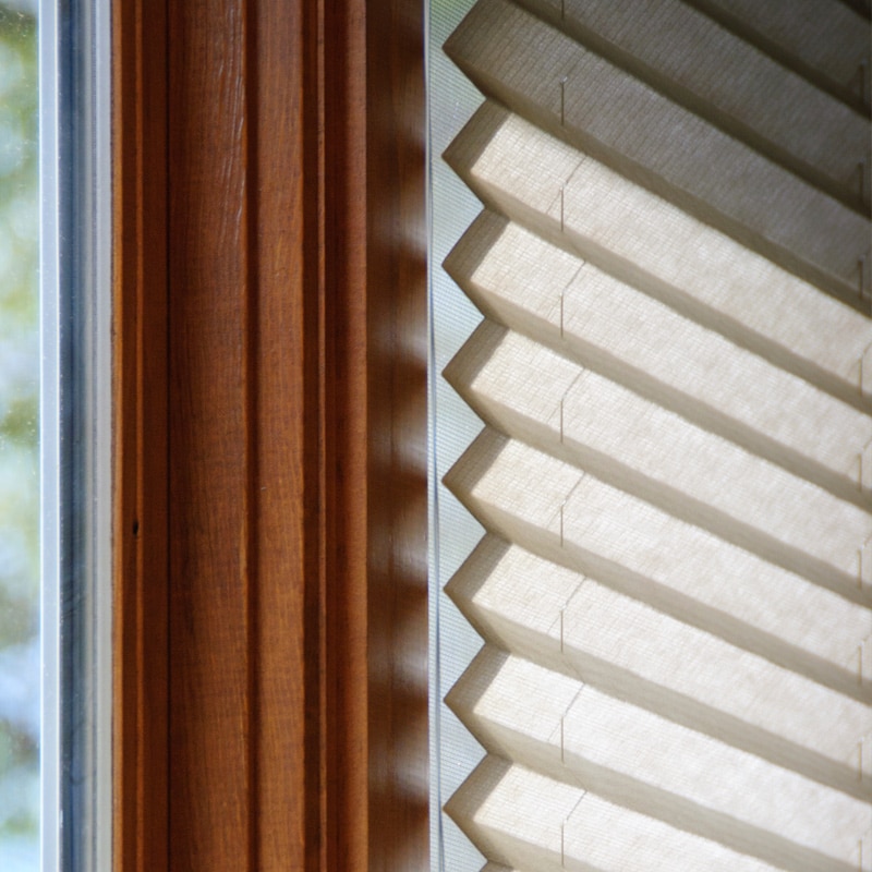 Here we show pleated solar shades in a light cream color. These shades are perfect for the first stage of the window design. They can take place of traditional draw sheers for a more contemporary look. Dial 773-Classic today for your free estimate!